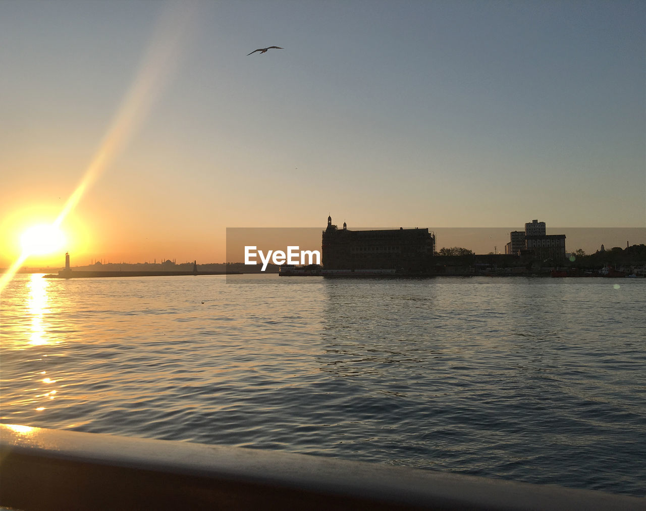 VIEW OF CITY AGAINST SKY AT SUNSET