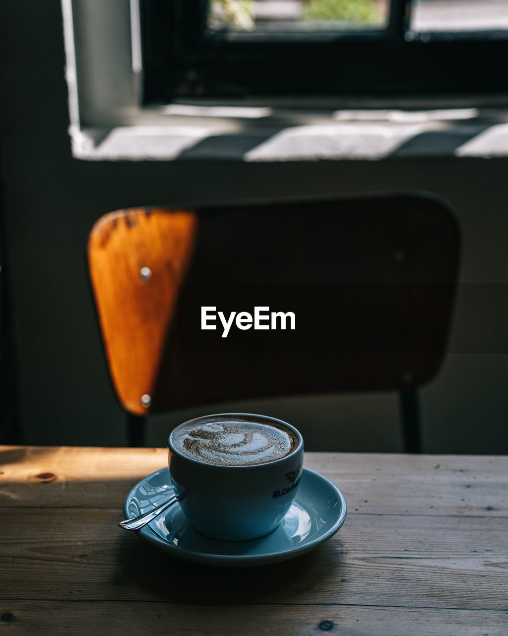 Close-up of coffee cup on table