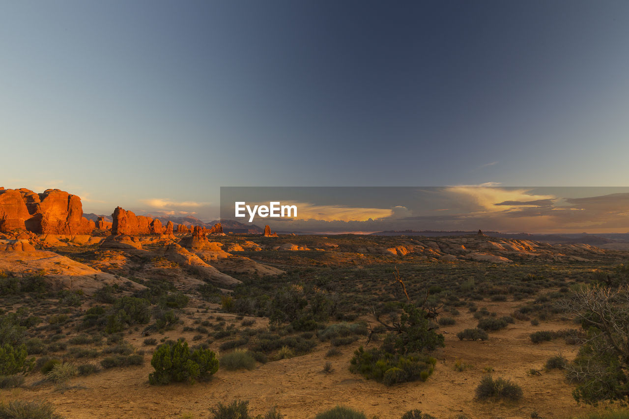 Panoramic view of arches national park, utah, at sunset, with famous red rocks in the background
