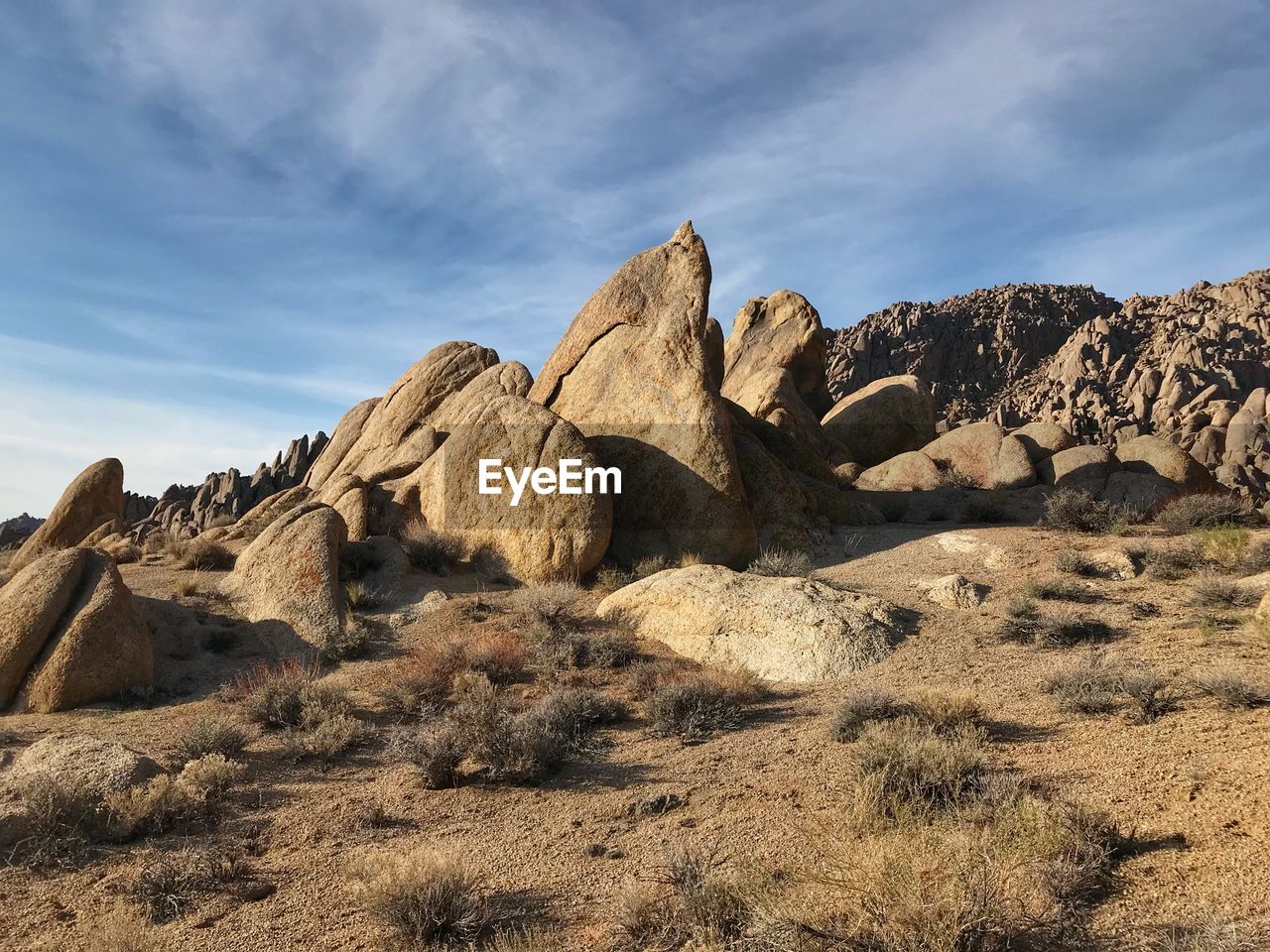 Rock formations on landscape against sky