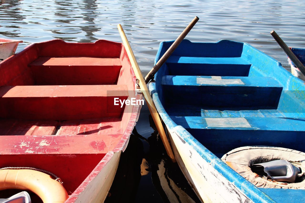 High angle view of rowboats moored at lake