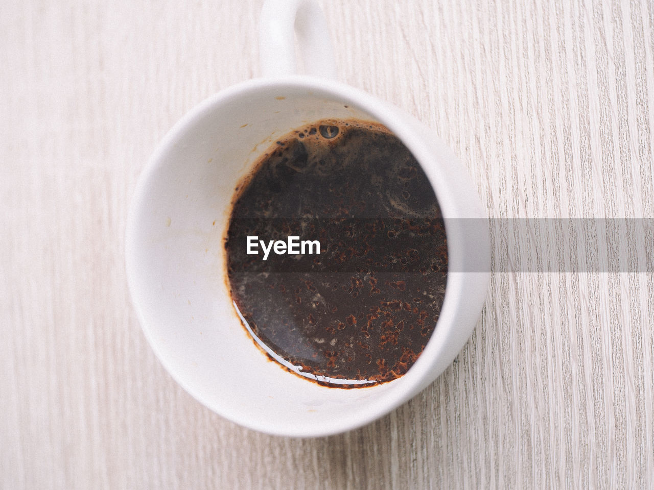 High angle view of coffee cup on table