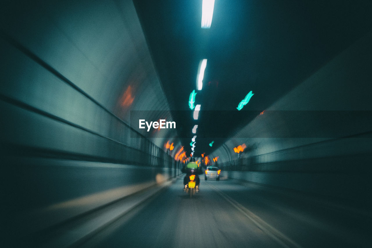 Blurred motion of illuminated greenwich tunnel in london, united kingdom