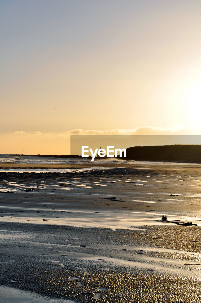 VIEW OF BEACH AT SUNSET