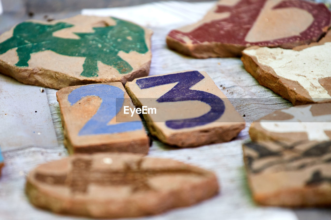 Colorful clay tiles with the number 23