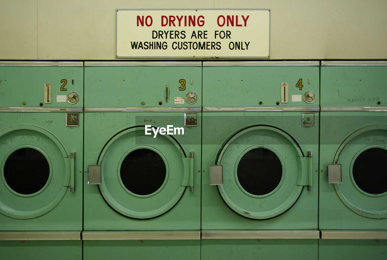 Full frame shot of dryers with text