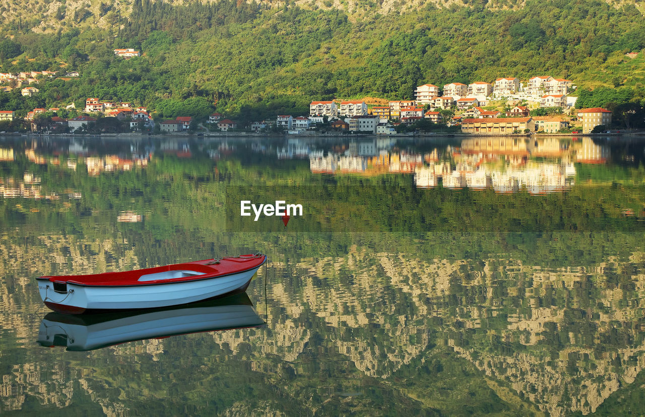 Boats moored at harbor