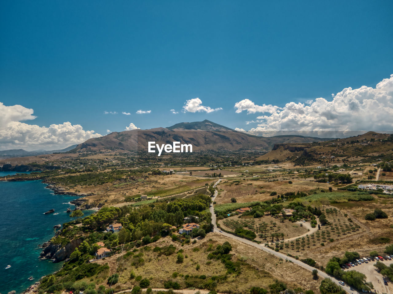 high angle view of townscape by mountains against clear sky