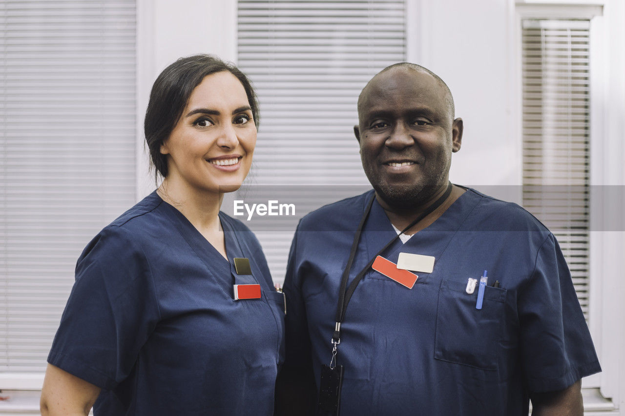 Portrait of smiling male and female medical staff at healthcare center