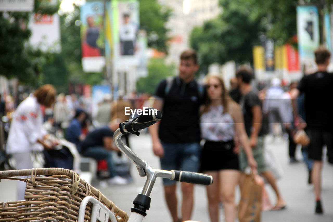 Bicycle with people on city street in background