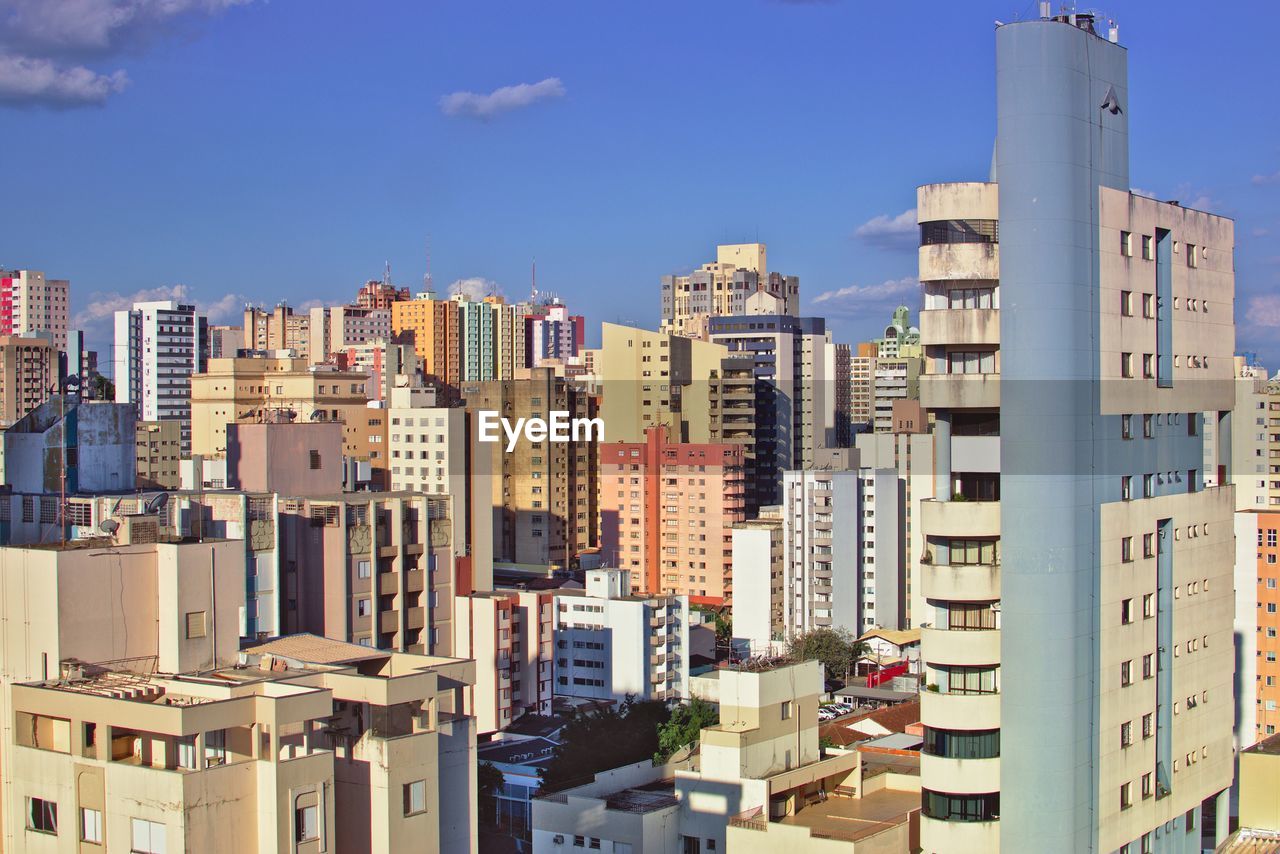 CITYSCAPE AGAINST BLUE SKY