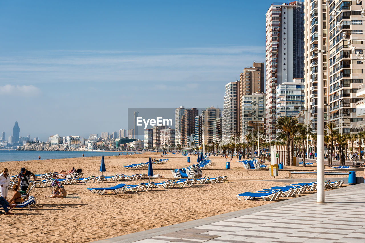 Panoramic view of beach and city against sky