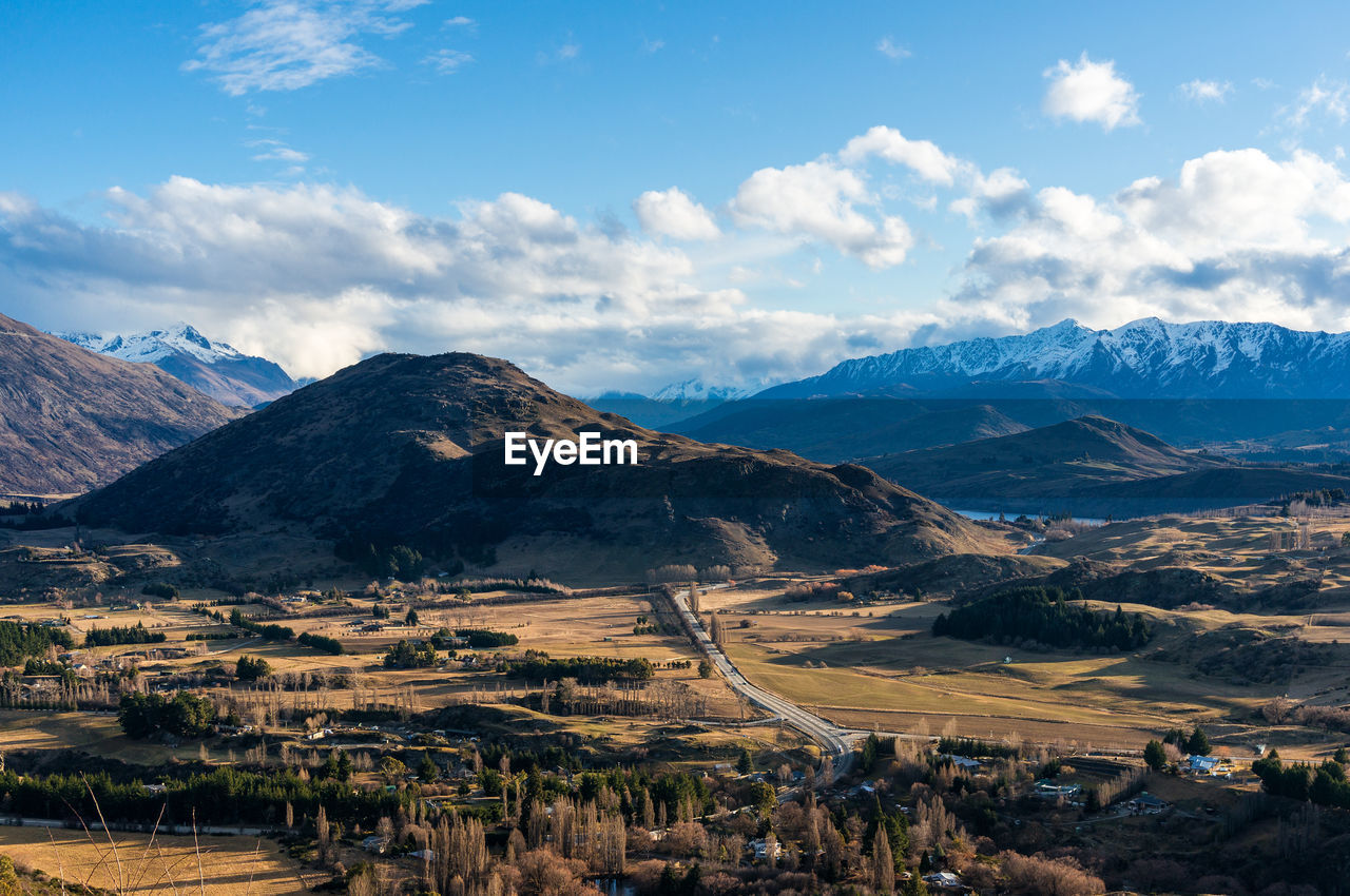 Scenic view of mountains against cloudy sky