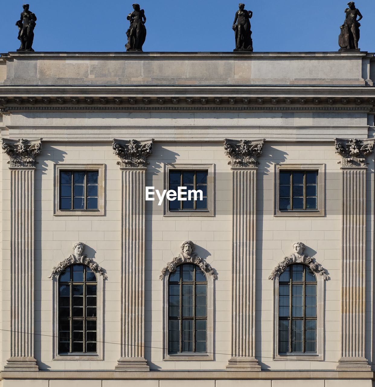 View of classical styled building against clear sky