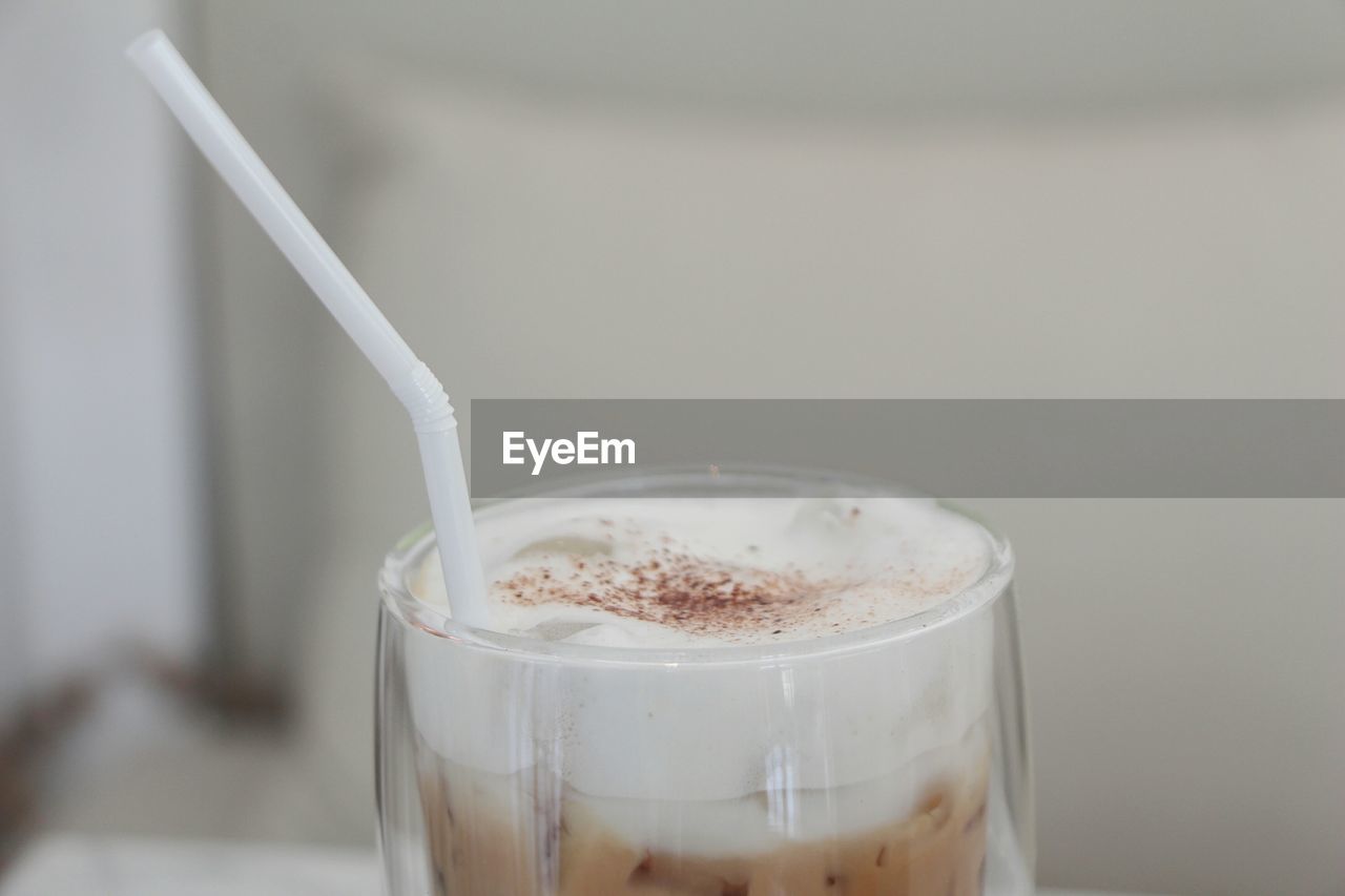 CLOSE-UP OF COFFEE CUP ON TABLE