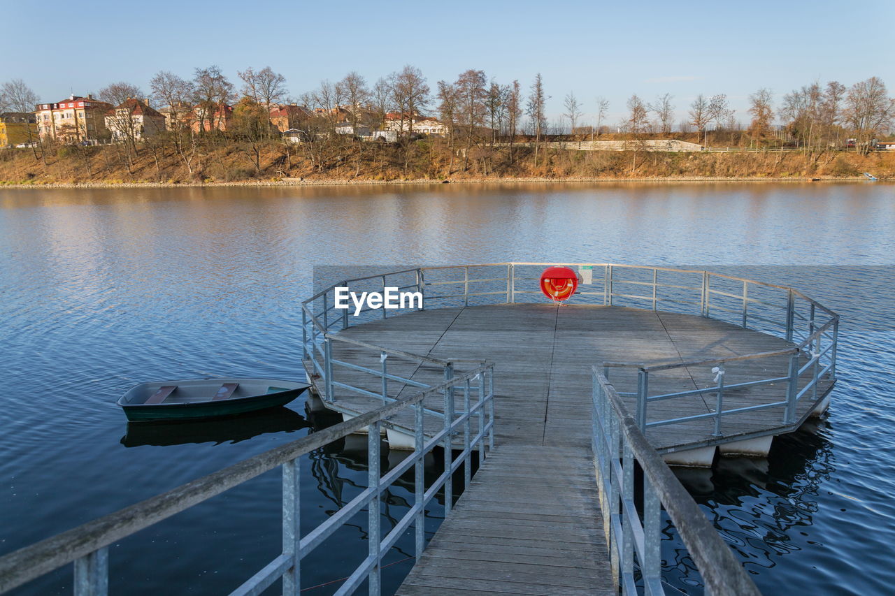 PIER BY LAKE AGAINST SKY