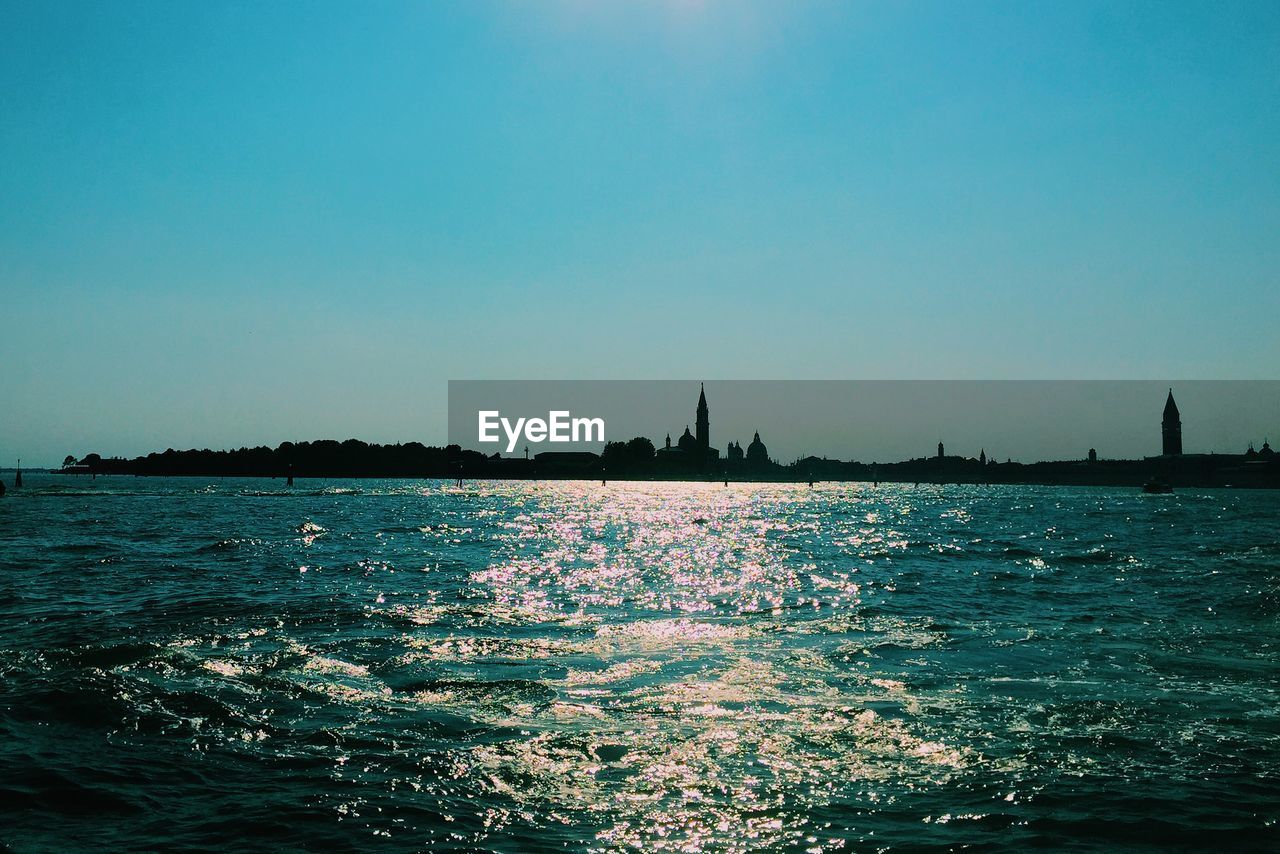 Scenic view of sea against blue sky