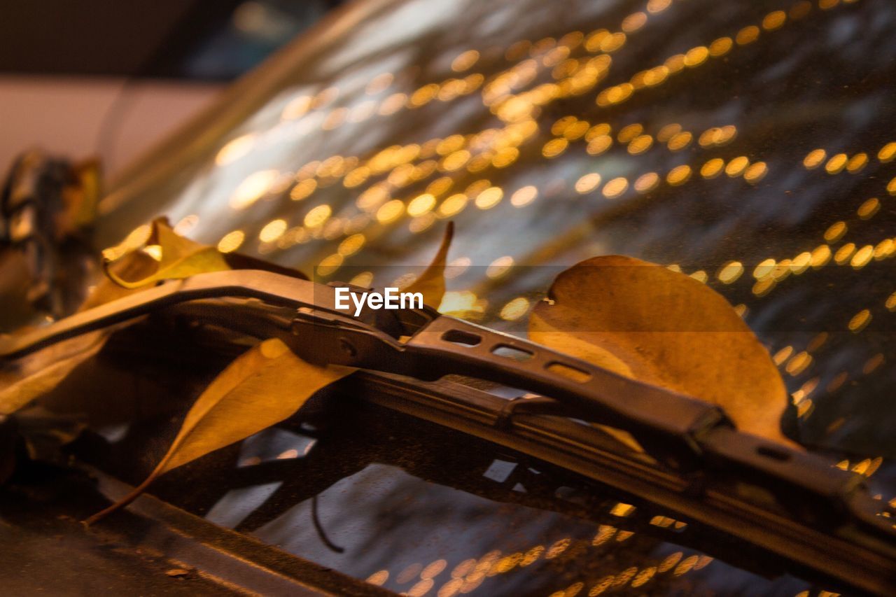 Reflection of illuminated lights on car windshield