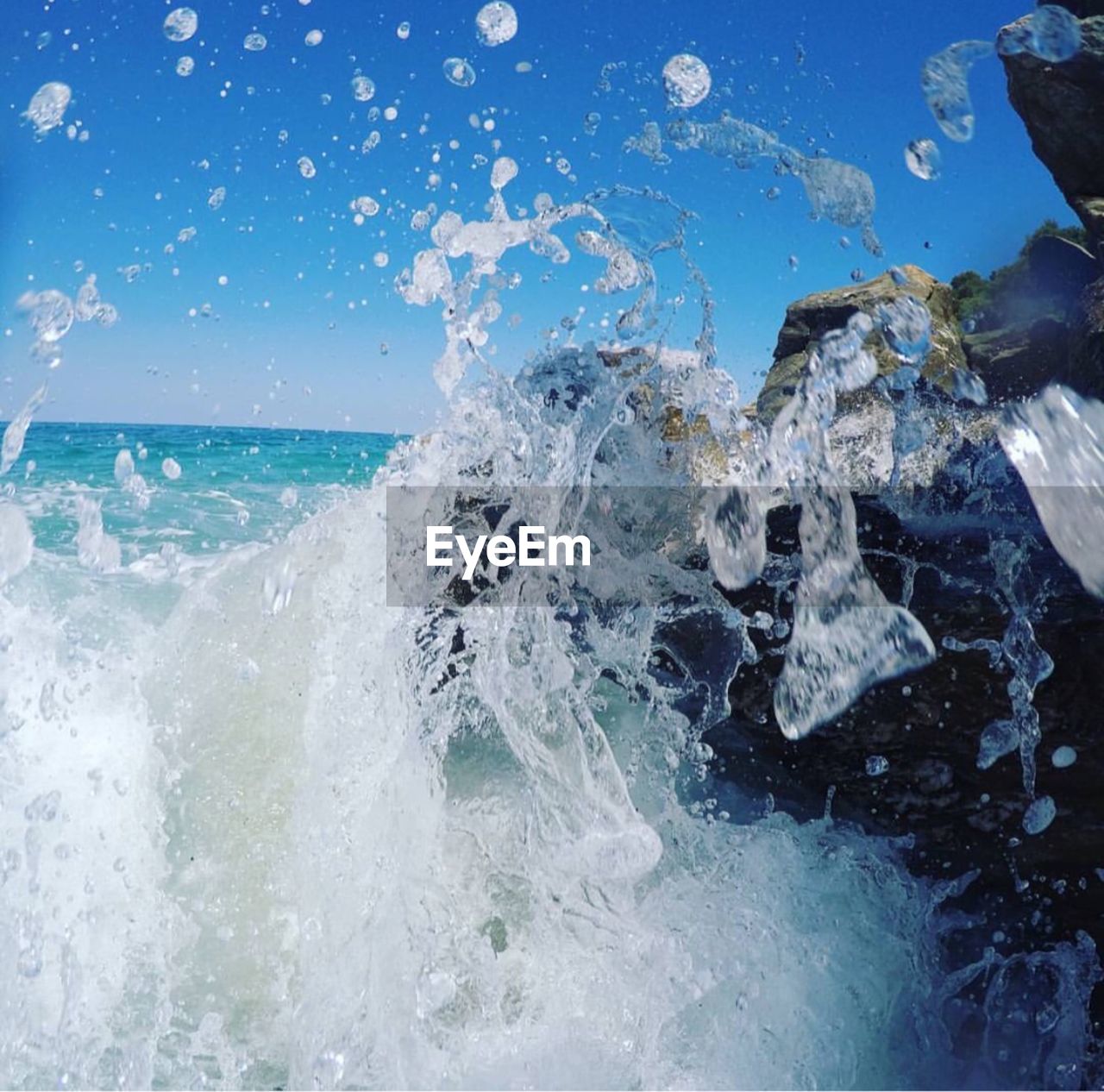 Waves splashing on rocks