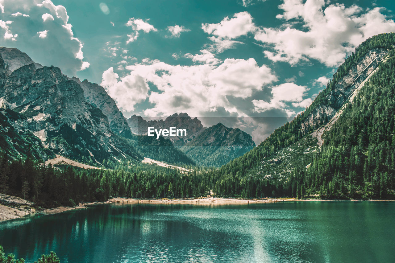 Scenic view of lake and mountains against sky