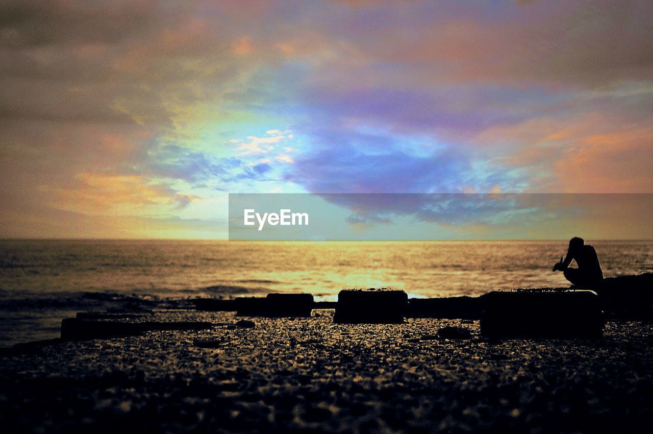 VIEW OF SEA AGAINST CLOUDY SKY