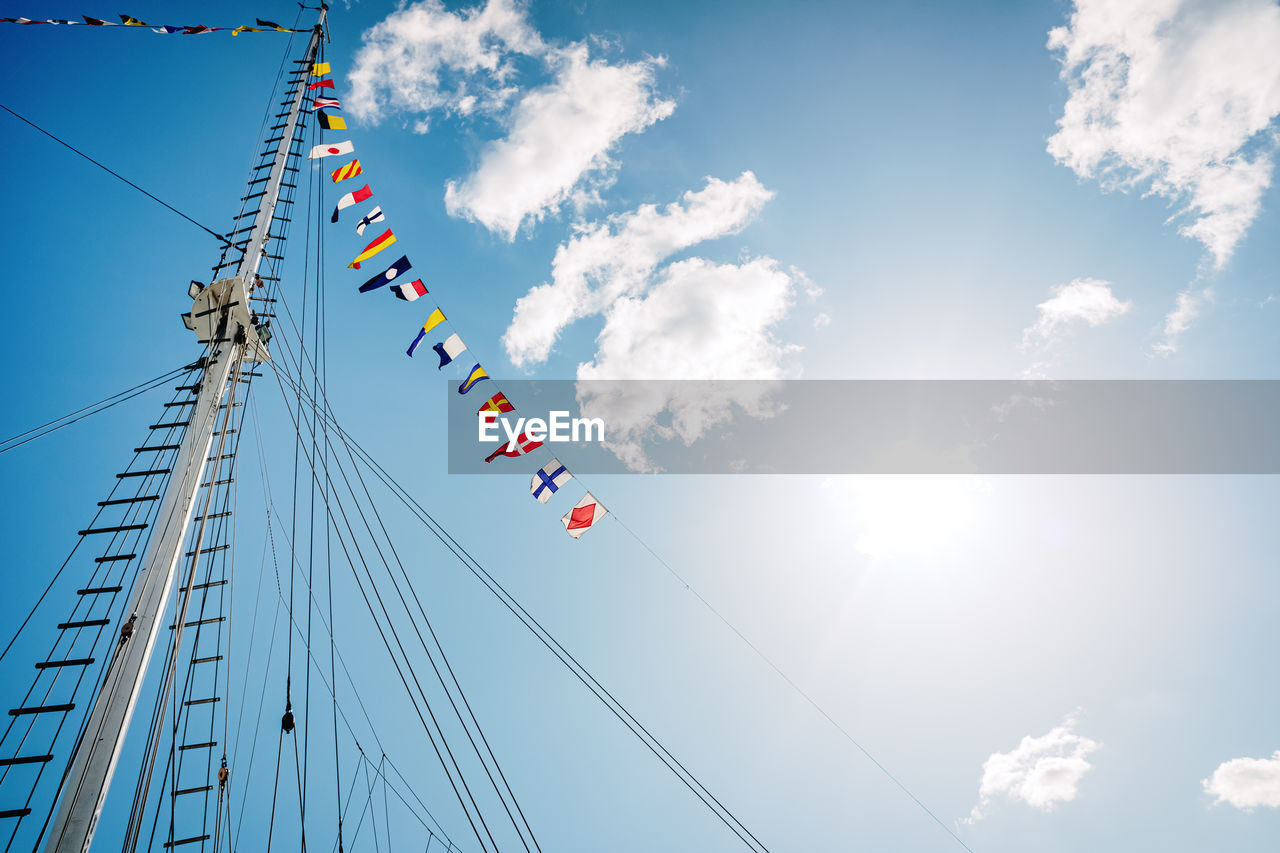 LOW ANGLE VIEW OF FLAG AGAINST SKY