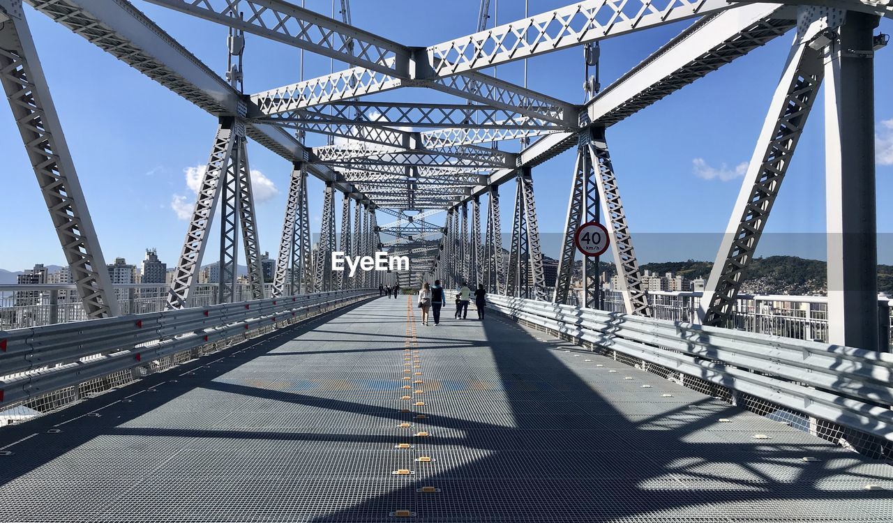 People walking on bridge