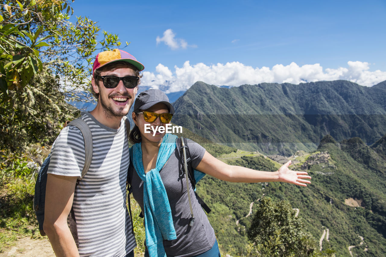 Couple posing for camera on the inca trail close to machu picchu