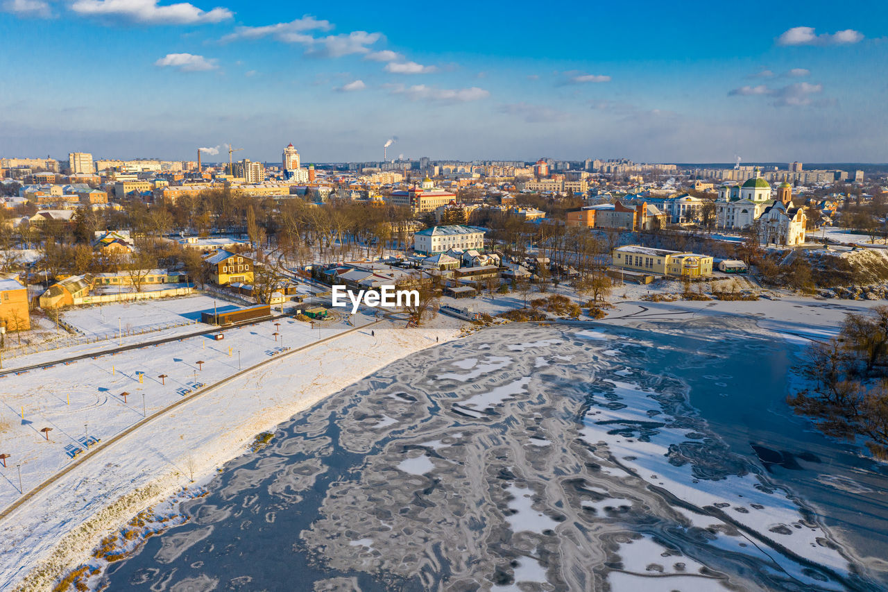 Nice top view of the winter city. bridge over river. orthodox churches and a catholic cathedral.