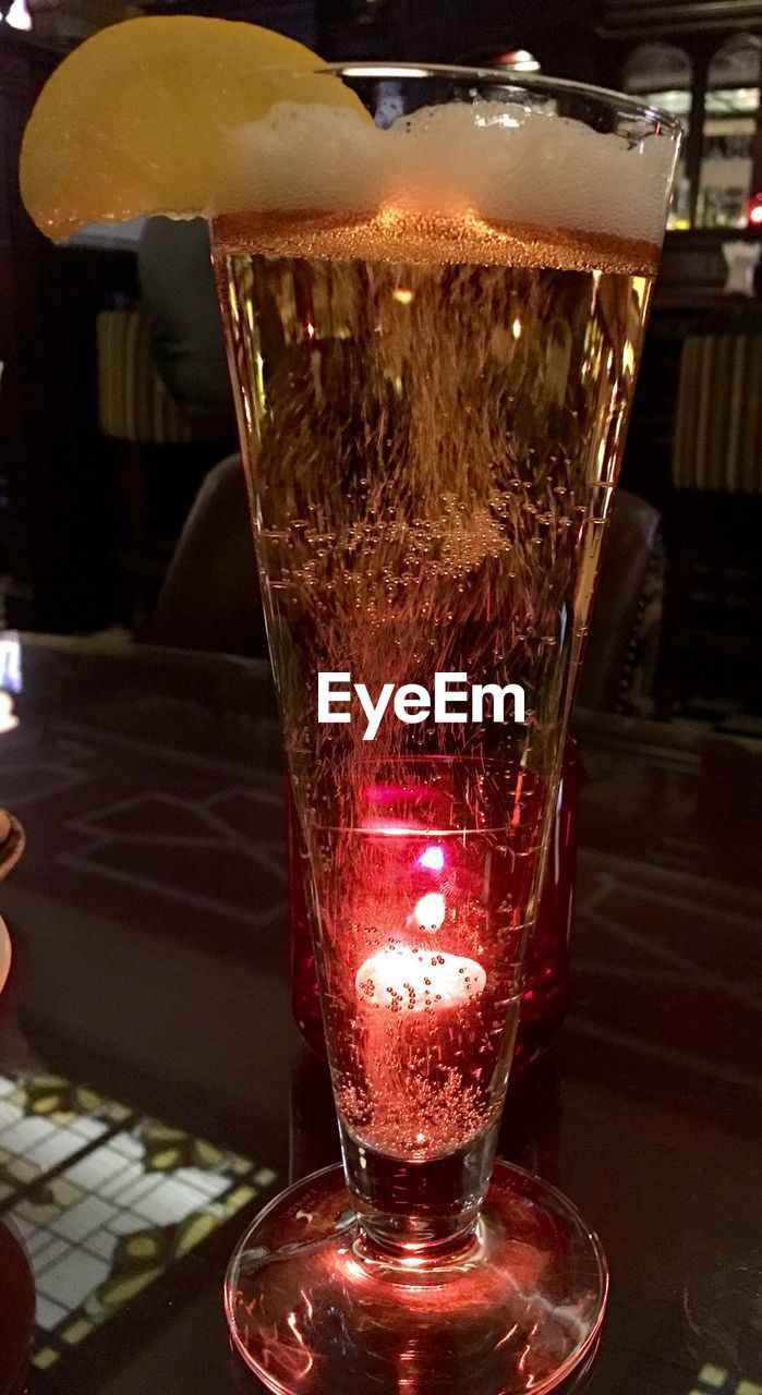 CLOSE-UP OF DRINK ON TABLE