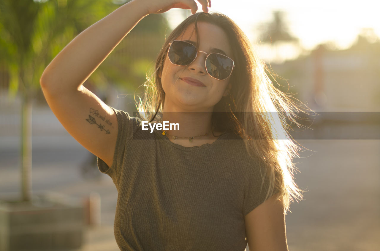 Portrait of young woman wearing sunglasses