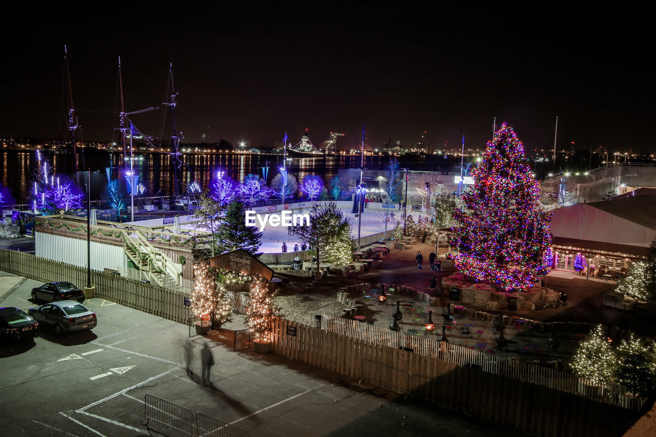 High angle view of christmas decorations by harbor against sky