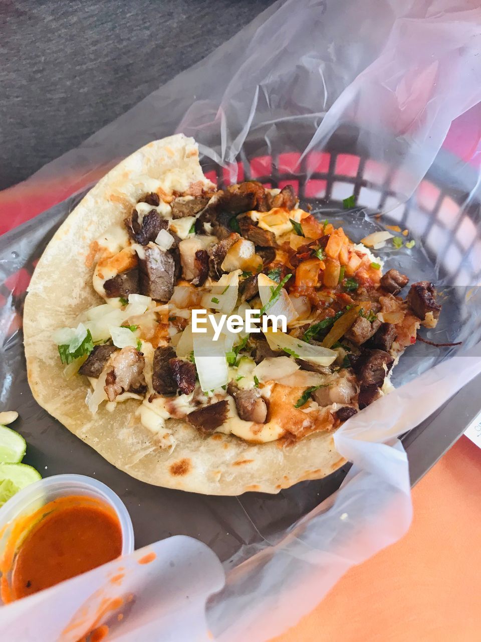 High angle view of food on plastic paper in basket