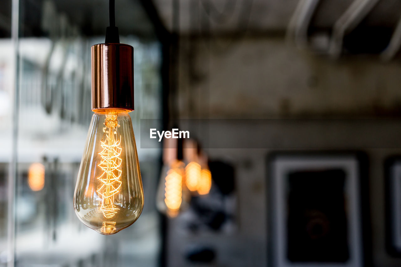 Close-up of illuminated light bulb