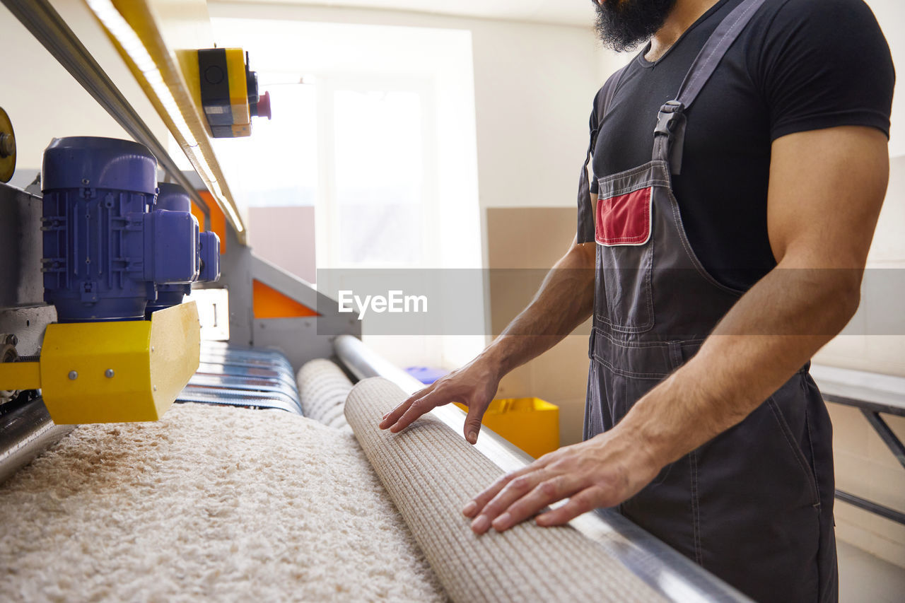 Midsection of man working at home