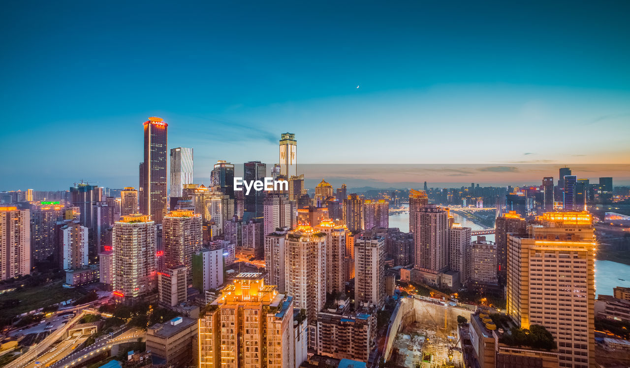 Aerial view of city lit up at night