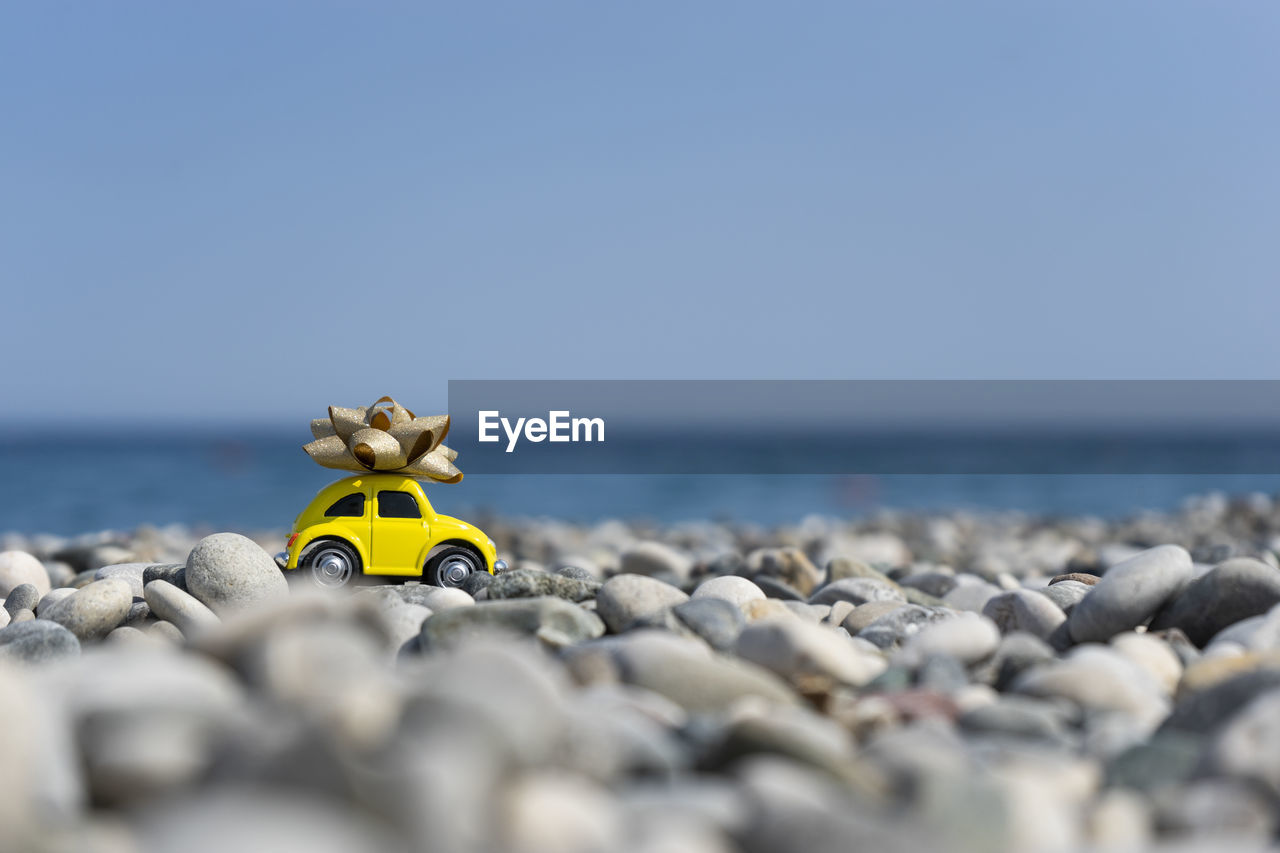 A car standing on the stones on the beach