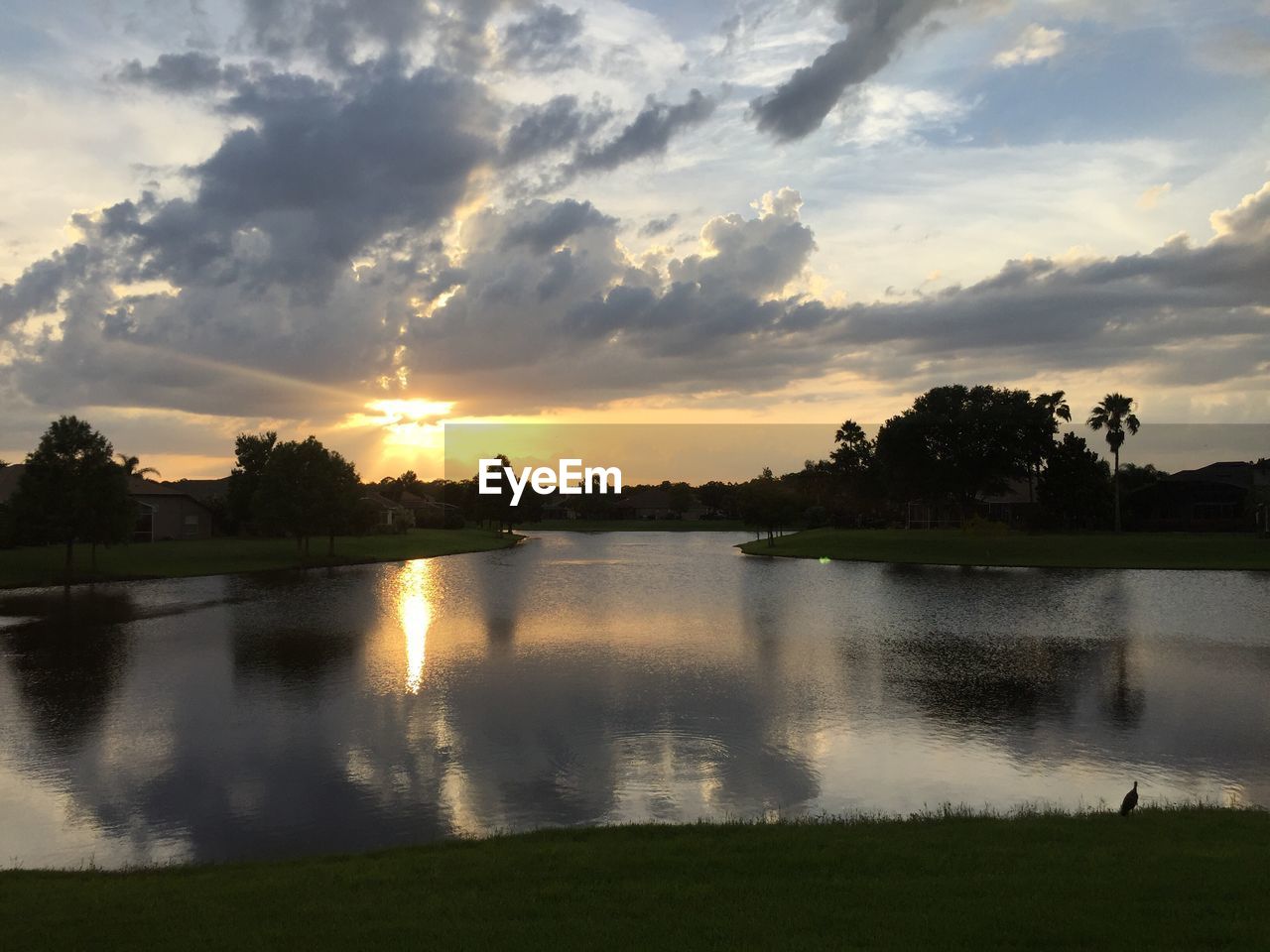 VIEW OF LAKE AGAINST SKY DURING SUNSET