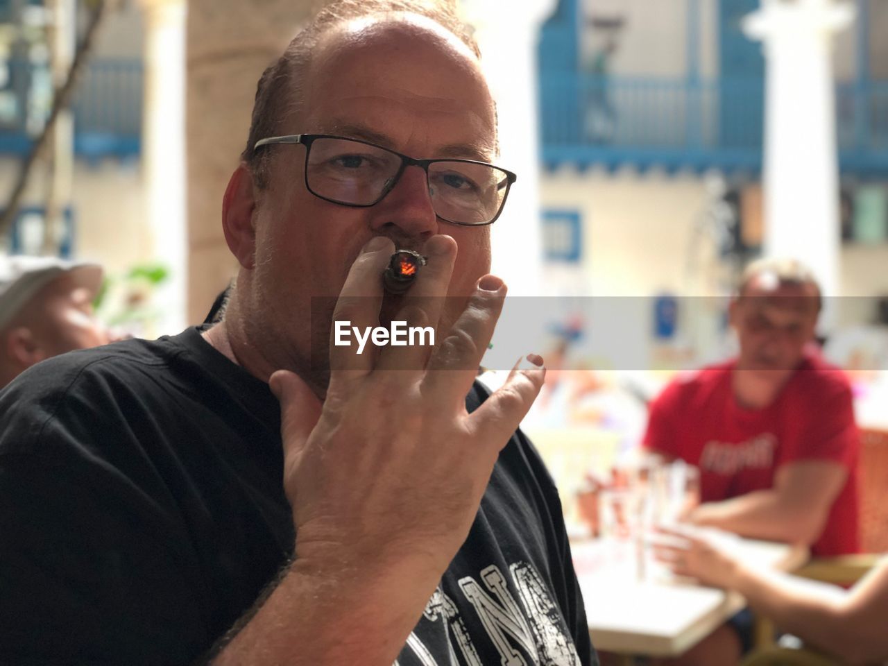 Portrait of man smoking cigar