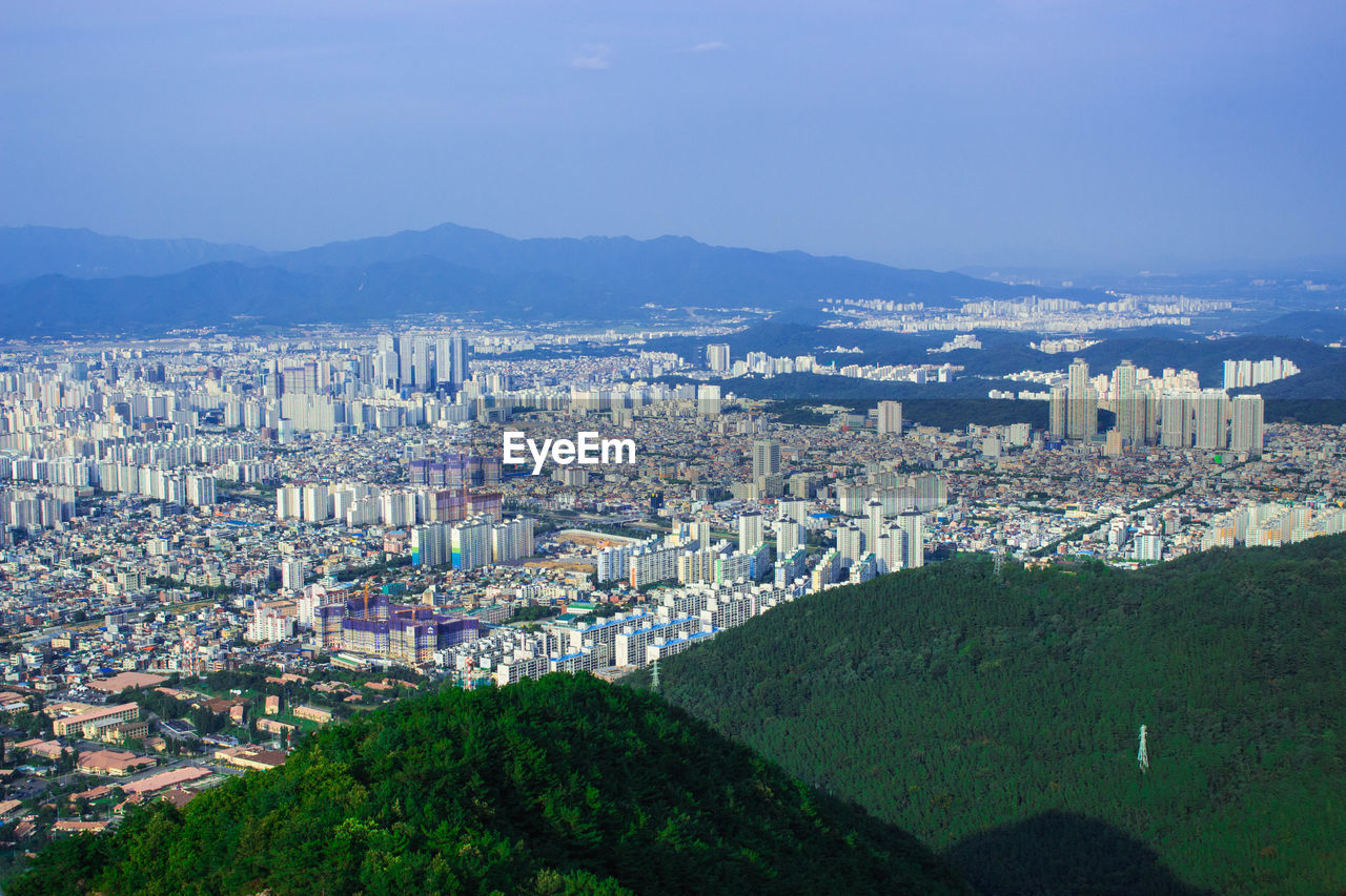 High angle view of buildings in city against sky