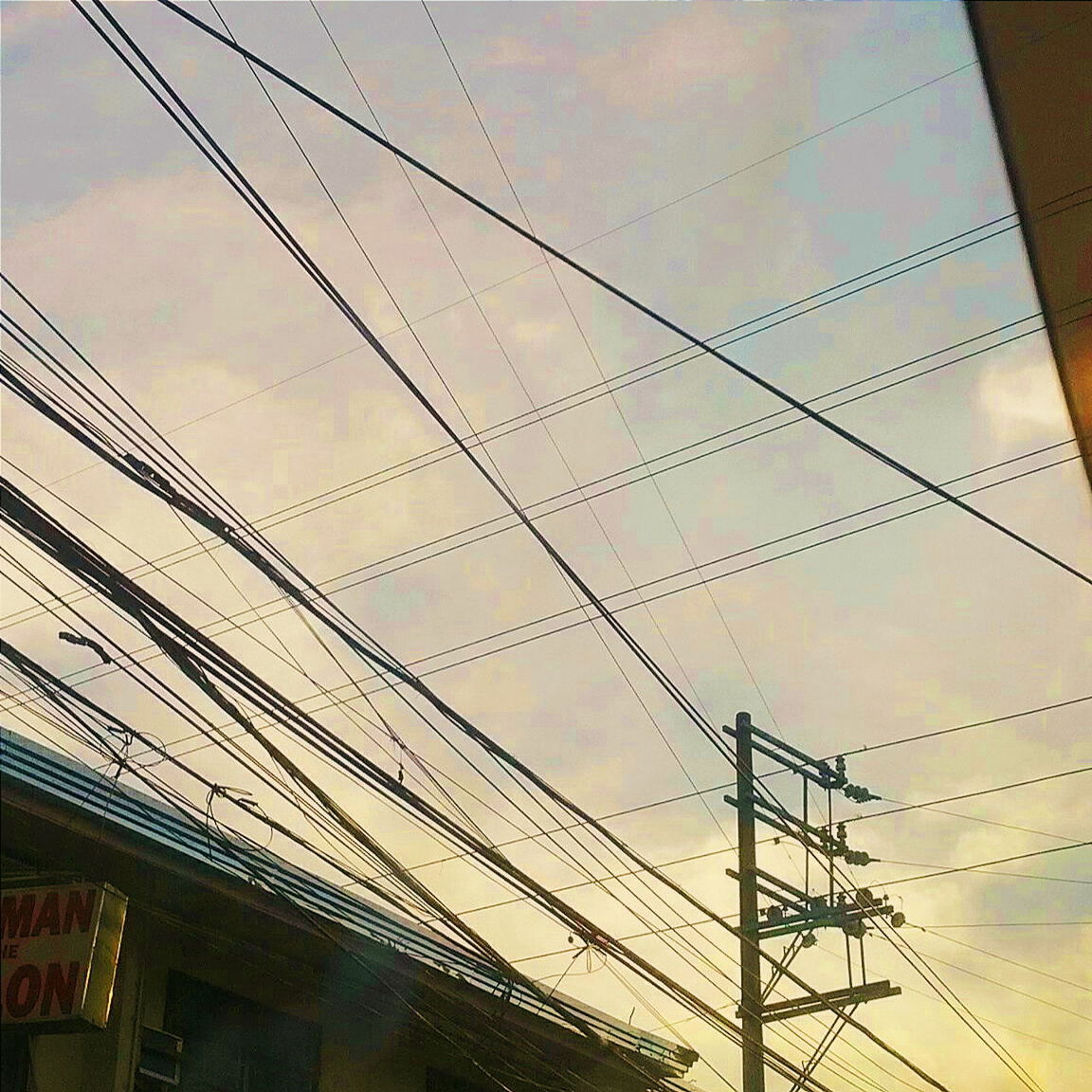 LOW ANGLE VIEW OF ELECTRICITY PYLON AGAINST SKY