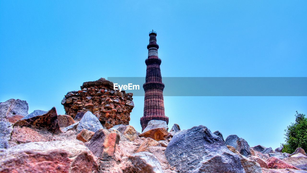 Low angle view of rock formation against blue sky