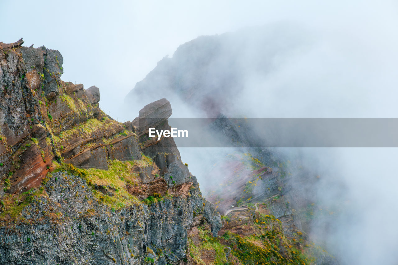 A mountain covered in fog and clouds. madeira island, portugal