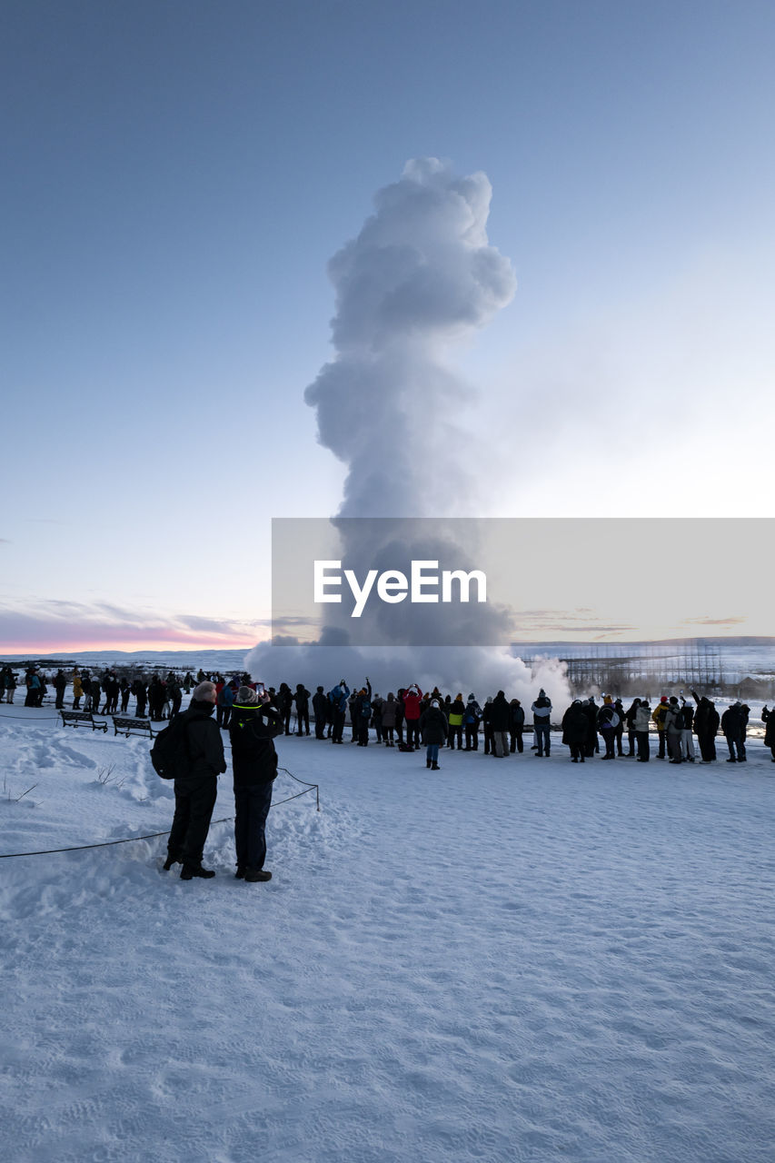 snow, group of people, sky, winter, crowd, large group of people, nature, environment, cold temperature, ice, land, water, landscape, cloud, beauty in nature, men, travel, outdoors, smoke, day, freezing, travel destinations, blue