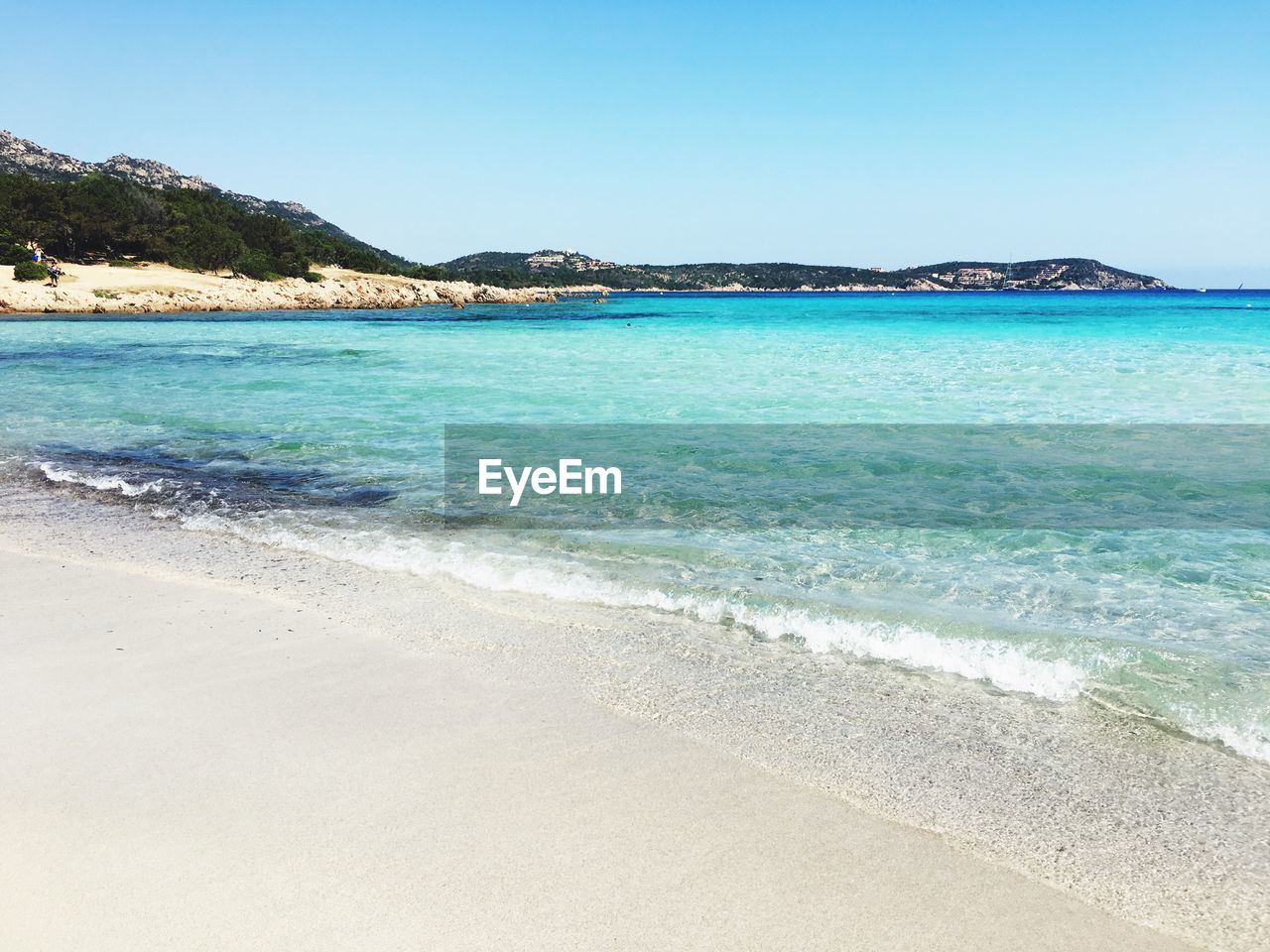 Scenic view of sea against clear blue sky