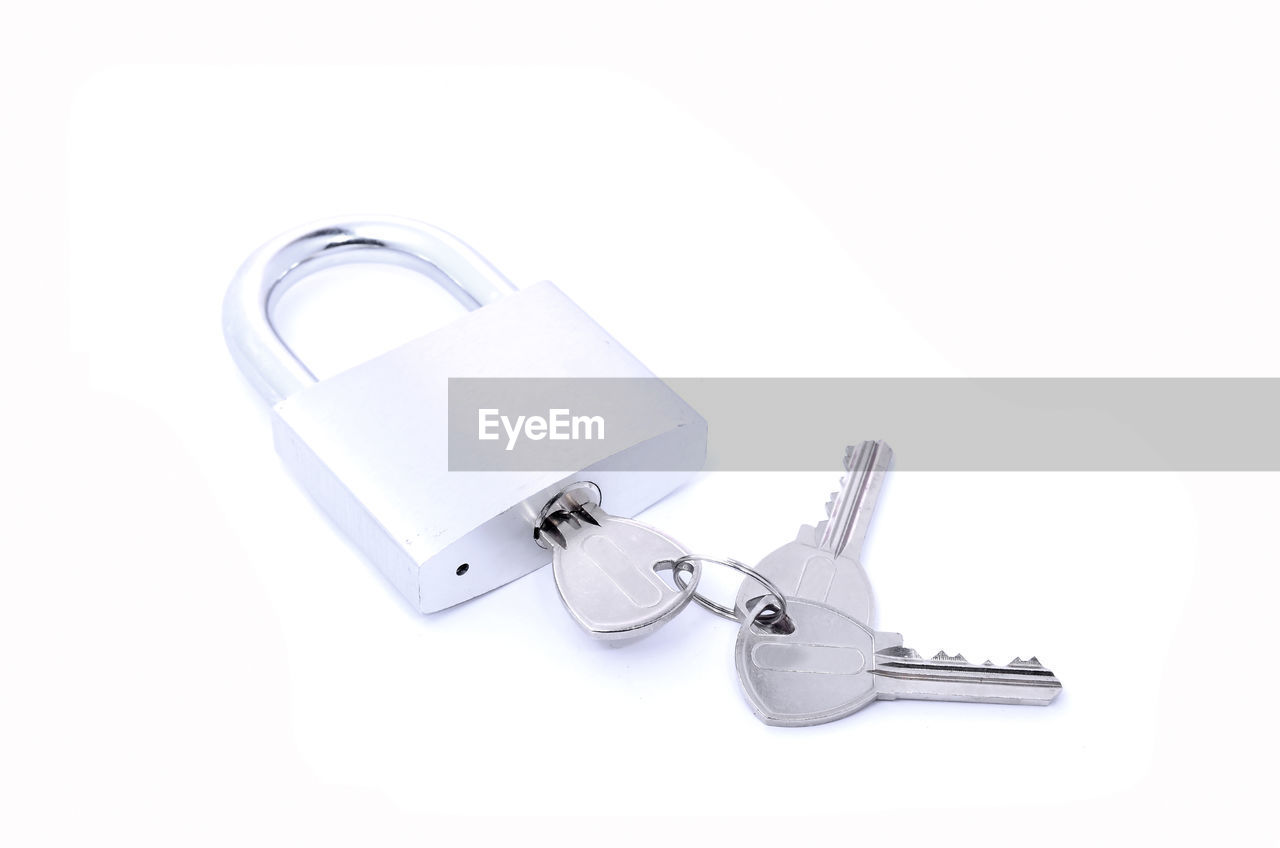 Padlock and keys on white background