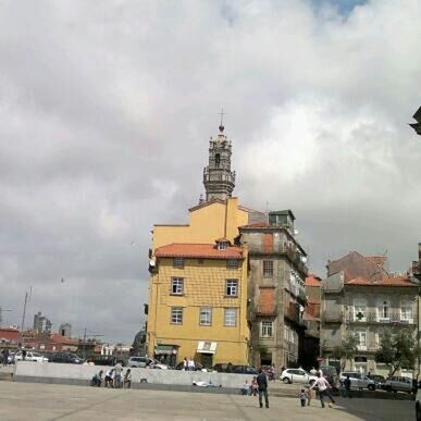 VIEW OF CITY STREET AGAINST CLOUDY SKY