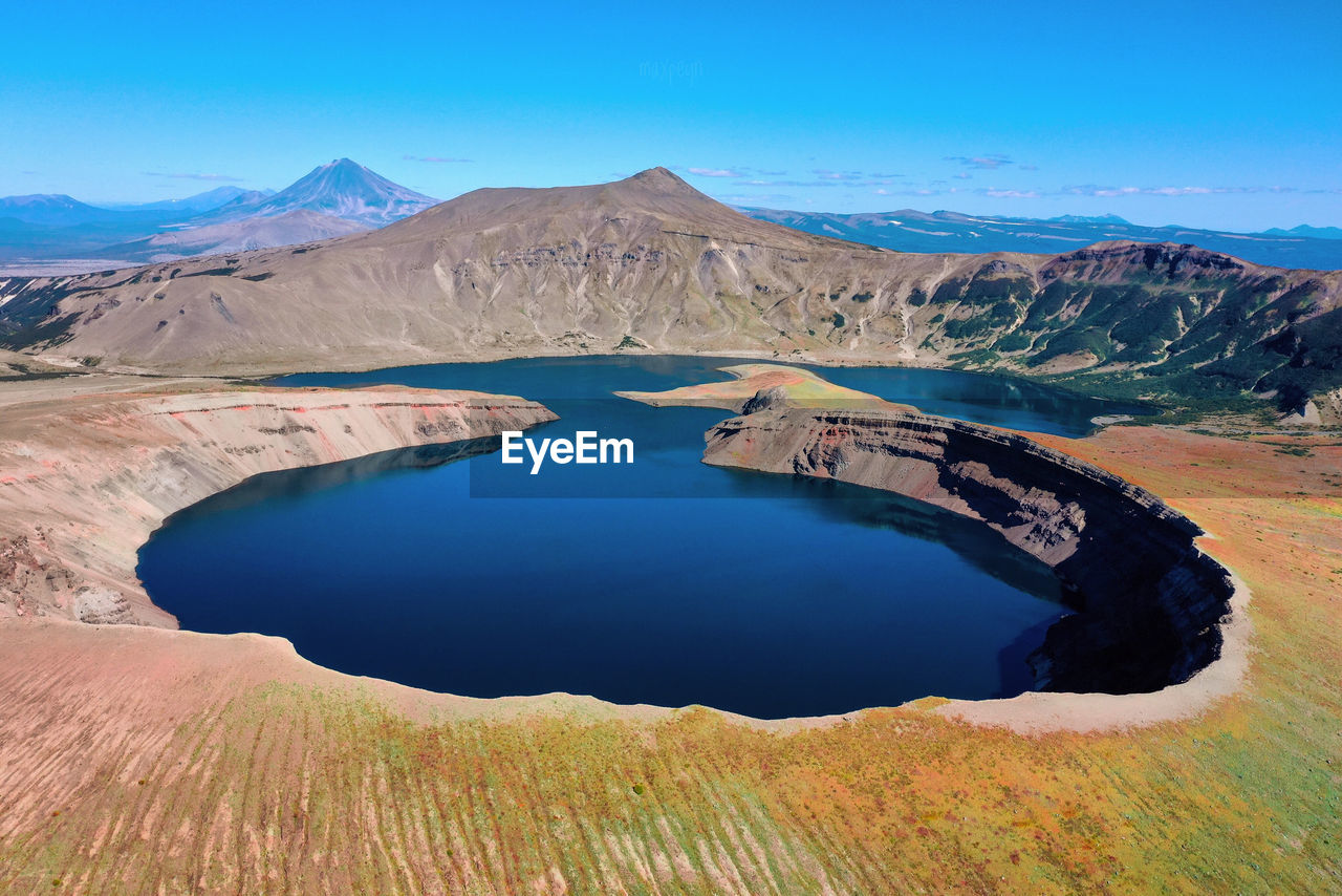 Scenic view of lake against blue sky