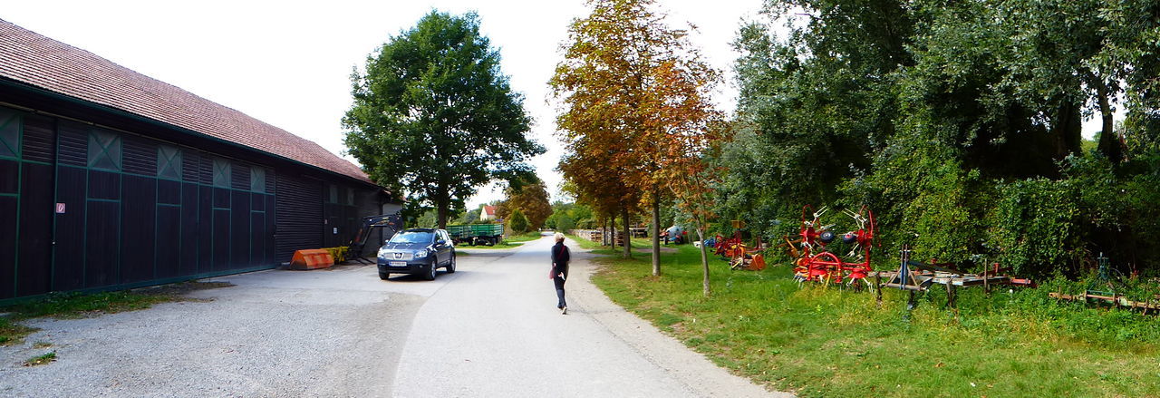 CARS ON STREET AGAINST SKY