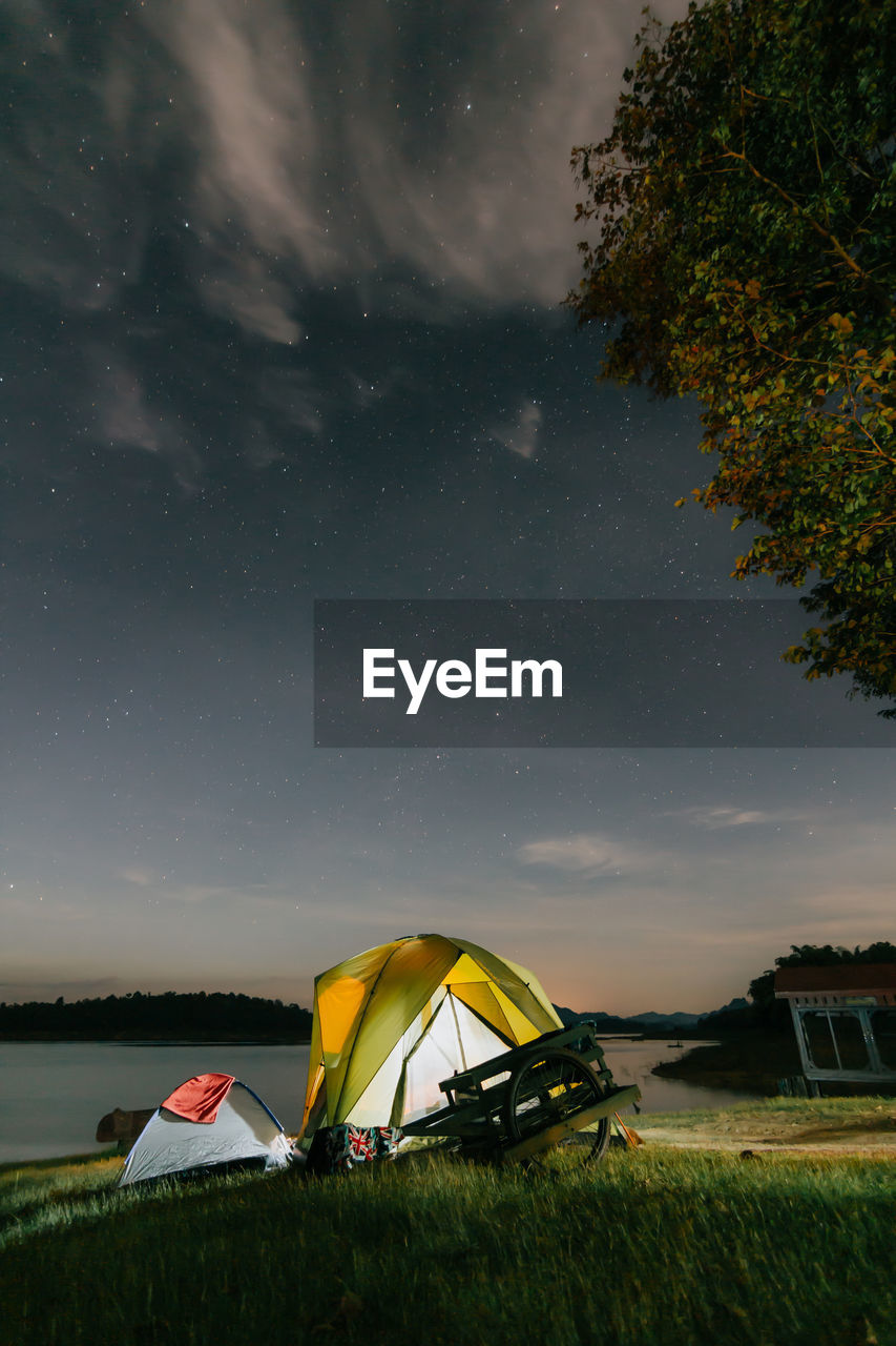 SCENIC VIEW OF TENT ON FIELD AGAINST SKY